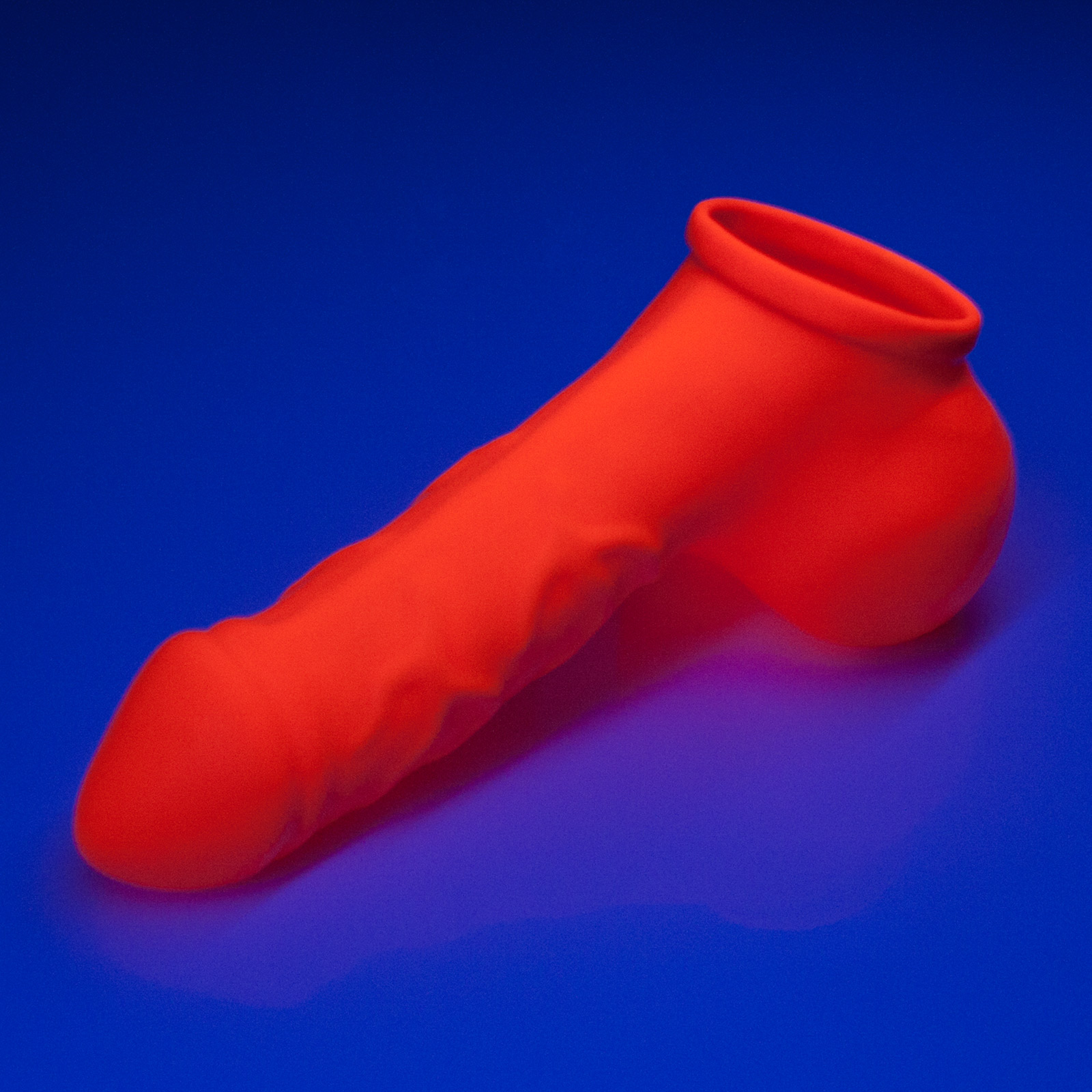 Toylie Latex Penis Sleeve «DANNY» neon orange (glow effect), with strong veins and testicle divider